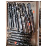 1 lot containing various sized tapper shank carbon steel drill bits.