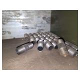 Shelf of black/ galvanized pipe fittings