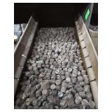 Shelf of black pipe fittings.