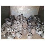 Shelf of galvanized pipe fittings