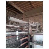 contents of shelf.  several pieces of angled steel.  ranging in length from rements to 20 feet.