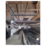 contents of shelf.  several pieces of steel, solid round, round pipe and angled.  lengths range from 10 to 20 feet.