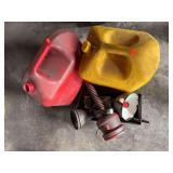 2 gas cans and assortment of funnels