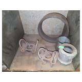 Shelf of galvanized pipe fittings.