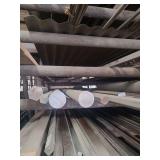 contents of shelf. several pieces of solid round steel,hexagon shaped solid steel,solid square steel, round pipe, sizes range from rements to 20 foot lenghts.