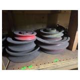 Shelf of misc sized black sprockets