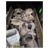 Shelf of black pipe fittings.