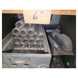 Shelf of black/ galvanized pipe fittings