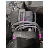 vintage electric motor attachment or small machinery component, possibly for a lathe or grinding setup,