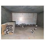 Shelf of black/ galvanized pipe fittings