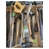 Box of hammers, hack saw and concrete tools