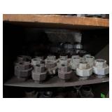 Cubby of black pipe fittings