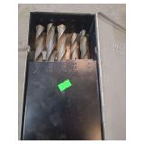1 metal box containing large drill bits