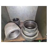 Shelf of black/ galvanized pipe fittings