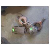 vintage industrial pulleys, often referred to as barn pulleys or block and tackle components.