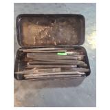 small metal box containing various sized center punches