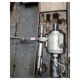 tapping head tool, specifically identified as a Supreme VersaTAPPER.