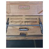 lot containing  a vintage Starrett precision measuring tool set, housed in its original wooden fitted case. Based on the components shown, it is likely an inside micrometer set (such as a Starrett 124