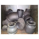 Shelf of black/ galvanized pipe fittings