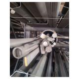 contents of shelf.  several pieces of steel, angled, round pipe, solid round and solid square.  lengths range from rements to 20 feet.