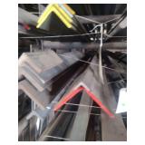 contents of shelf.  several pieces of various sized angled steel.  lengths range from rements to 20 feet