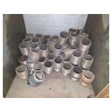 Shelf of black/ galvanized pipe fittings