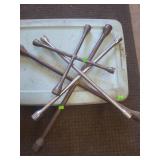 lot contains 3 different sized tire irons and a blue tote