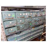 Teal storage container on shelf of various sized o rings