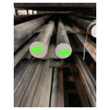 Two pieces of solid round steel approximately 1”x5’ and 1”x9’