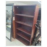 lot contains a 5 shelf wooden display or bookcase.