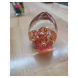 Glass paper weight.