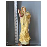 Angel playing harp statue.