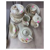 Large set of depression glass serving dishes, pitchers, cups