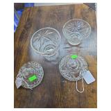 Two small glass cups with lids