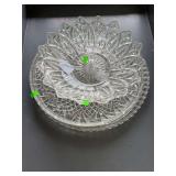 Two round glass serving trays and serving bowl.