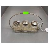 Salt pepper and sugar dispensers with holder.