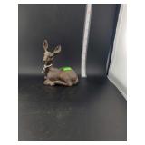 lot contains a vintage Red Mill figurine, which is a collectible sculpture typically crafted from a composite of crushed pecan shells and resin.