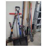 lot contains several yard tools to include 2 shovels,  4 rakes. landscaping rake, stand up welders, snow shovel, broom, small tree saw