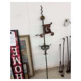 vintage architectural item is a wrought iron weathervane