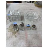 4 salt/pepper shakers, one glass dish and one glass container with lid