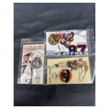 John Elway HoF pin, a game pin, and a McCaffrey pin