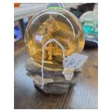 Musical wolf snowglobe.