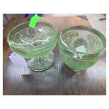 Two green glass cups.
