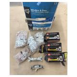 Box of collated staples, cable staples, two switches, and a small set of storage bins