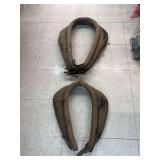 Antique draft horse collars and harness pieces