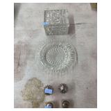 4 salt/pepper shakers, one glass dish and one glass container with lid