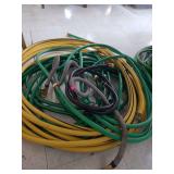 lot contains several pieces of water hose of different lengths.