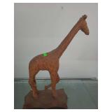 lot contains a hand-carved wooden giraffe sculpture, which is a popular form of African folk art often crafted in Kenya. 15 inches tall