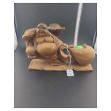 lot contains a hand-carved wooden figure of Budai,