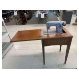 Sears Kenmore sewing machine in cabinet. Model 1120